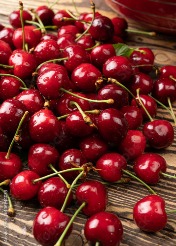 Sweet cherry in water drops a bunch of juicy and ripe cherries