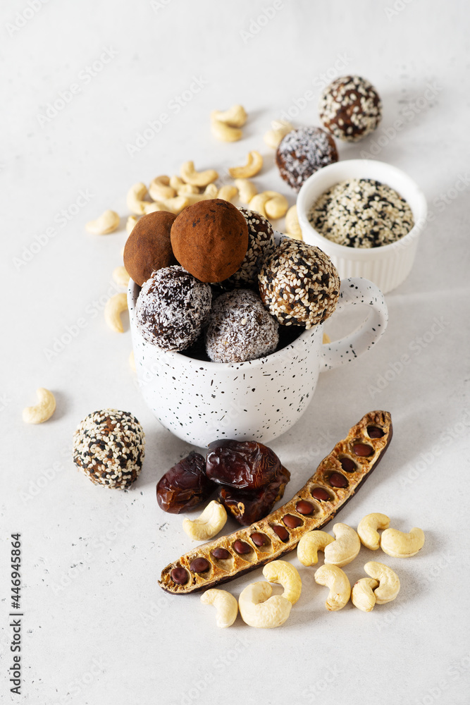 Carob energy balls with nuts, dates and coconut, vegan and vegetarian sweet food