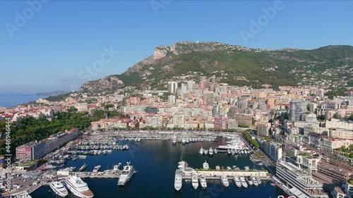 Monte Carlo, Monaco. Aerial view of famous city towering over Mediterranean Sea, yachts and boats in marina Port Hercules in La Condamine - landscape panorama of Europe from above photo