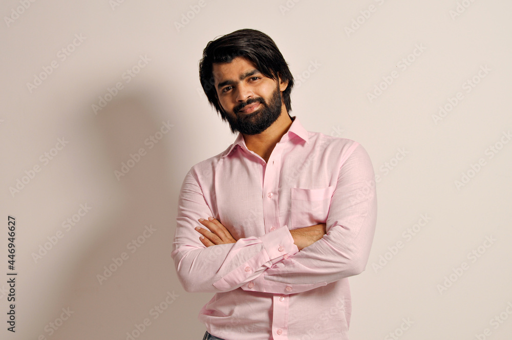 smiling handsome attractive Indian guy wearing formal shirt standing with crossed arms
smiling handsome attractive Indian guy wearing formal shirt standing with crossed arms