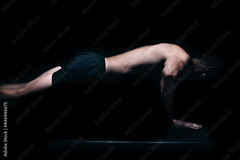Profile of a fitness man doing push-ups. Profile of a fitness man doing push-ups.