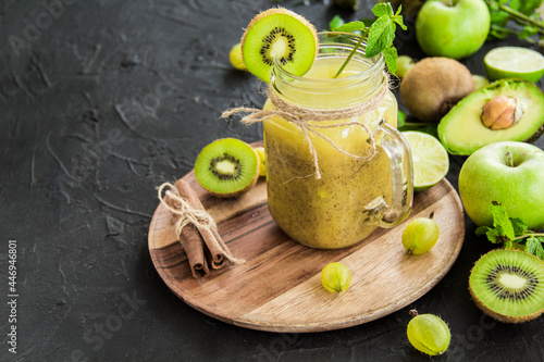 Healthy smoothie of fresh green fruits. Creative atmospheric decoration