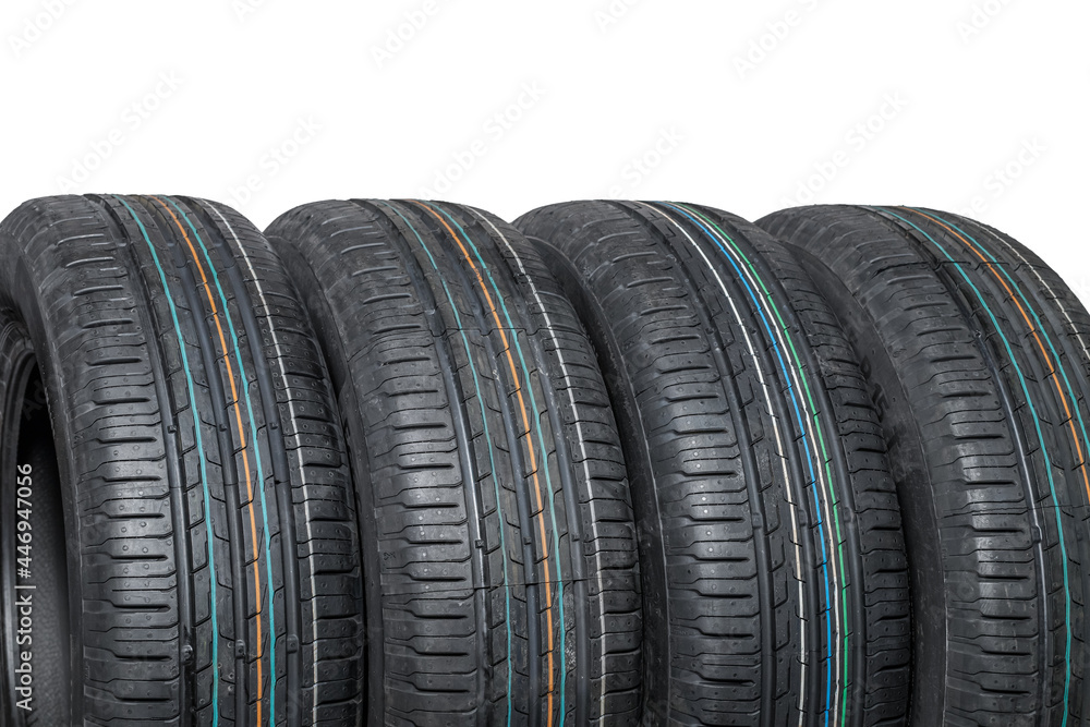 Close-up of four summer car tires isolated on white background Close-up of four summer car tires isolated on white background