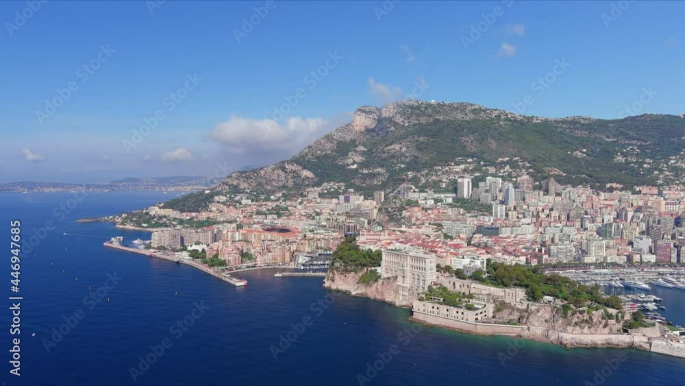 Monte Carlo, Monaco. Aerial view of famous city towering over Mediterranean Sea, ships and boats in yachting marina Port de Fontvieille - landscape panorama of Europe from above Monte Carlo, Monaco. Aerial view of famous city towering over Mediterranean Sea, ships and boats in yachting marina Port de Fontvieille - landscape panorama of Europe from above