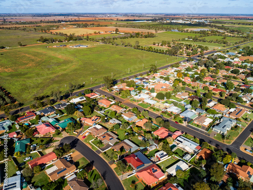 Aerial view of intersection of bush and built environment homes and farm paddocks photo