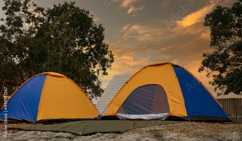 Tourist dome tent camping  in forest camping on sunset background