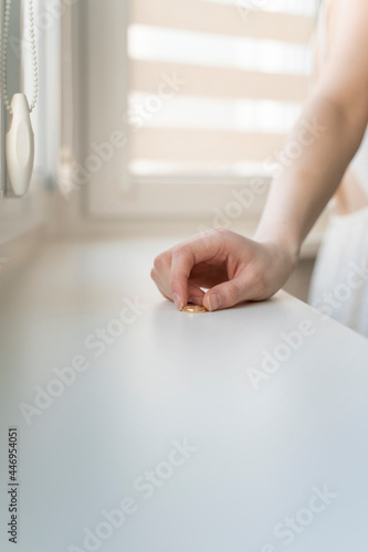 young woman took off her wedding ring. relationship problems, divorce