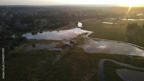 A bired's-eye view of the river and the Supraśl reservoir at sunset.A top viewe of the orthodoxmale manastery in Supraśl photo