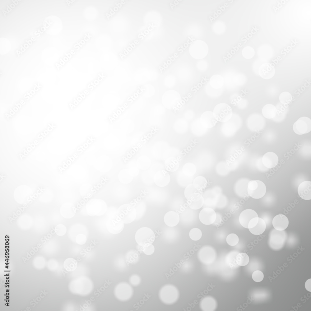 Winter light and white abstract bokeh on a bluish background