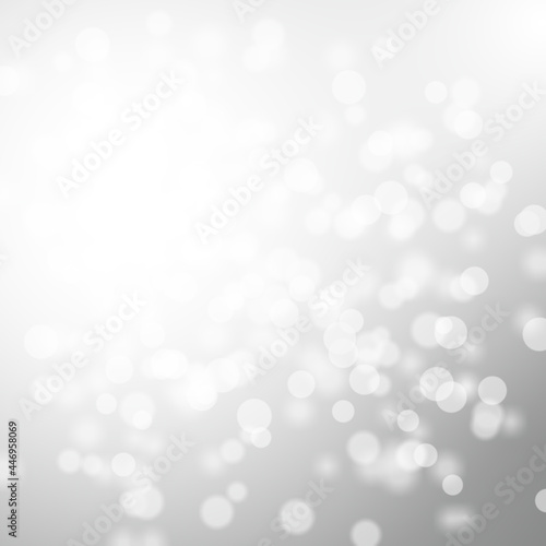 Winter light and white abstract bokeh on a bluish background