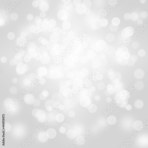 Winter light and white abstract bokeh on a bluish background