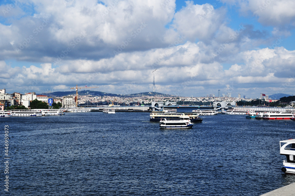 It's a nasty day. Panorama of the Golden Horn Bay. View of ships in the bay and pleasure boats. Istanbul, Turkey, July 10, 2021