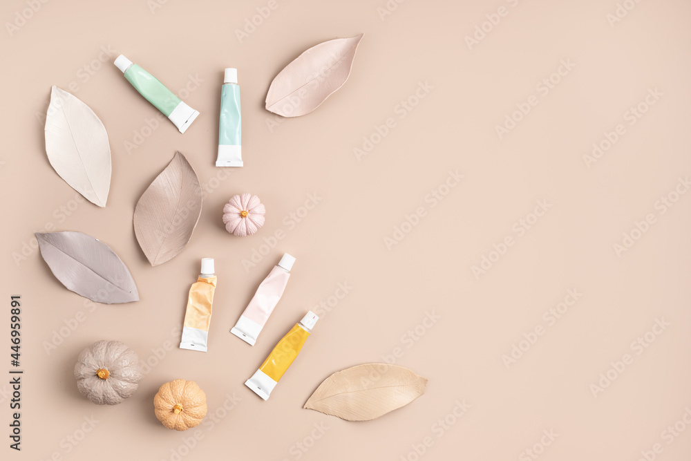 Hobby background with handmade gypsum pumpkins, paint brushes and art accessories Hobby background with handmade gypsum pumpkins, paint brushes and art accessories