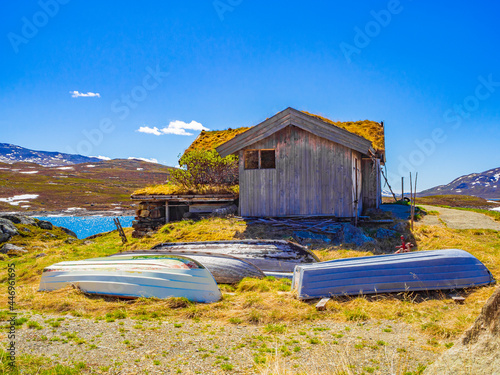 Idyllic hut with fishing boats near vavatn lake Hemsedal Norway. photo