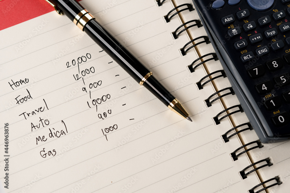 pen on household account paper, personal expenses monthly, home budget with calculator pen on household account paper, personal expenses monthly, home budget with calculator