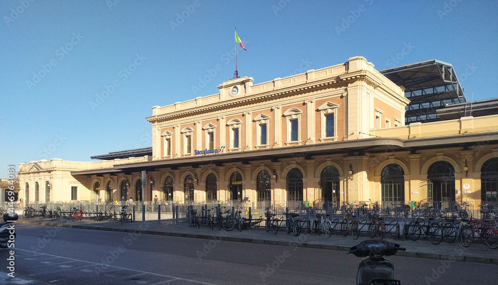 View of the main facade of the train station in Parma, Italy