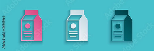 Paper cut Paper package for milk icon isolated on blue background. Milk packet sign. Paper art style. Vector
