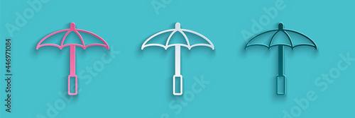 Paper cut Sun protective umbrella for beach icon isolated on blue background. Large parasol for outdoor space. Beach umbrella. Paper art style. Vector