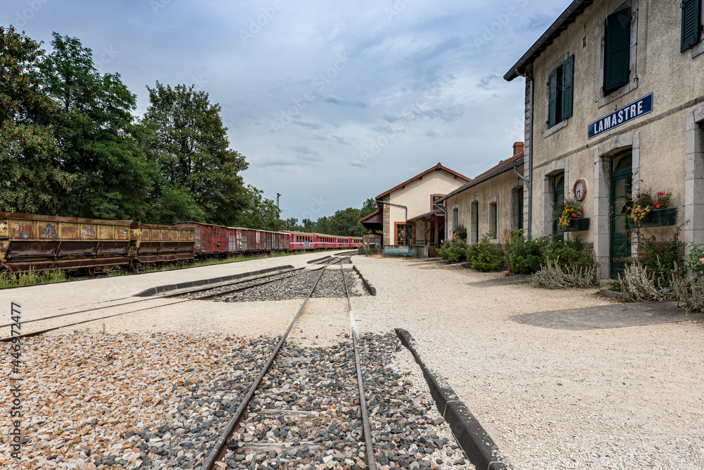 Old Lamastre train station with an antic freight train on the background at french Ardèche region.