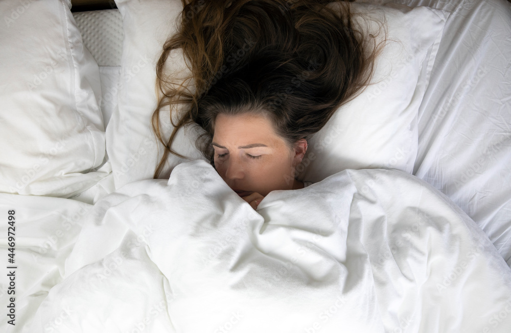 Young girl with freckles sleeping with white sheets top view, Portrait of the beautiful young woman sleeping in white bed in clean bedroom, lying down Young girl with freckles sleeping with white sheets top view, Portrait of the beautiful young woman sleeping in white bed in clean bedroom, lying down
