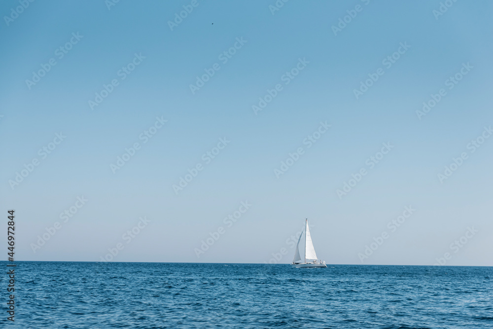 Sailing boat in navigation, Alghero