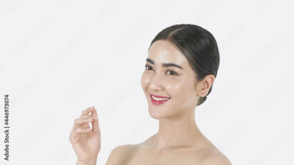 Beauty concept of 4k Resolution. A young Asian woman enjoying a refreshing face on a white background. Beauty concept of 4k Resolution. A young Asian woman enjoying a refreshing face on a white background.