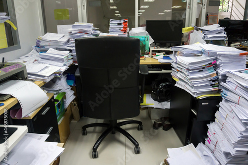 Busy, messy and cluttered workplace, full of documents photo