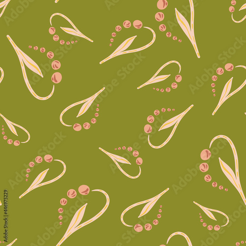 Random pink lily of the valley elements seamless doodle pattern. Green background. Bloom artwork.