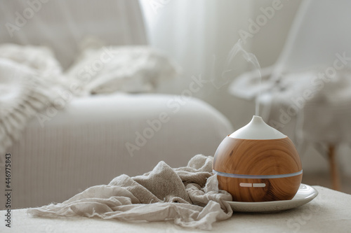 Vászonkép Cozy composition with aroma diffuser for air humidification.