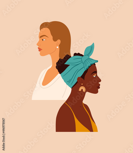 Two women of different nationalities and cultures standing together