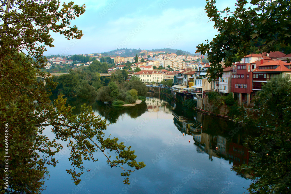 Reflections over the Tamega River in its pass through Amarante town in northern Portugal