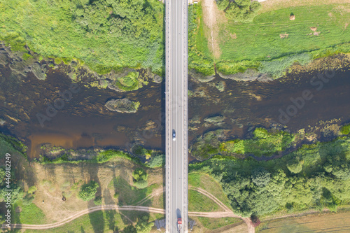 Принти на полотні Aerial top down view of car driving over bridge