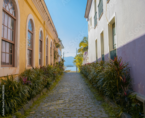 Historic center city in the interior of brazil colorful and rustic old houses on the coast of antonina, Paraná, narrow cobblestone street
 photo
