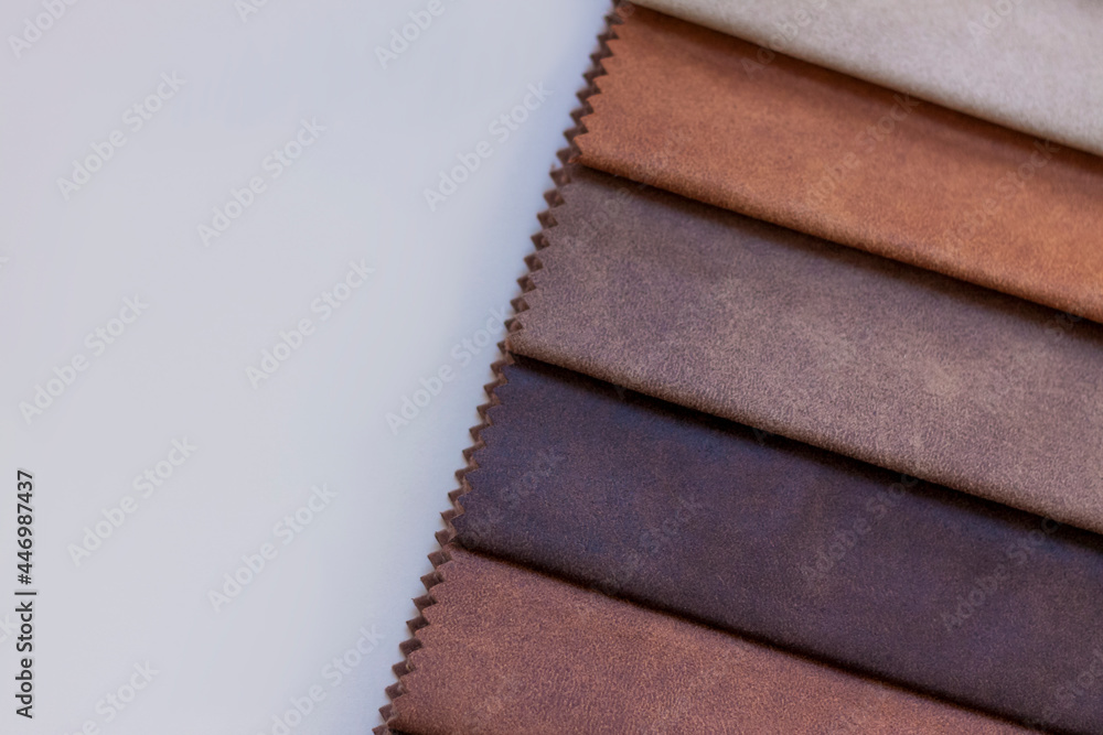 Fototapeta premium Backgrounds made of natural and artificial fabrics for the decoration of textiles, furniture and clothing on a beige background. Furniture production. wallpaper with space for copying text.
