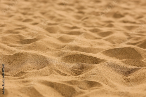 Sand on the beach for background. Close-up.