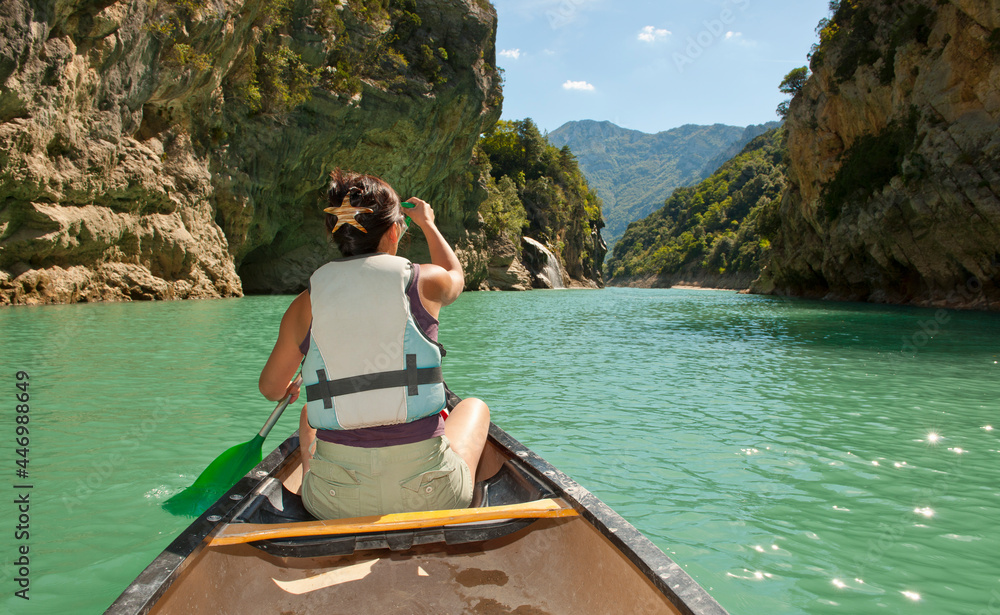 woman exploring the Verdon canyon on a canoe woman exploring the Verdon canyon on a canoe