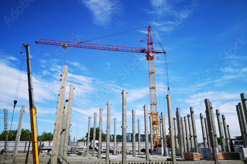 Фотография Construction site with cranes, complex work is underway to install an apartment building by the company BK: G