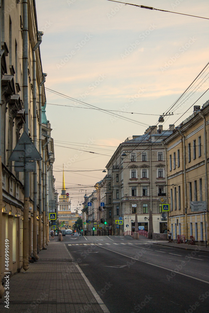 Saint Petersburg, Russia-July, 15, 2021: the perspective of the historical street of the city with a highway, cars and historical buildings on a summer day and a space for copying