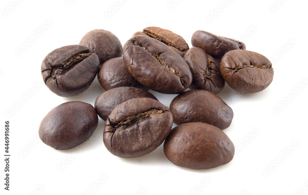 Roasted coffee beans close up isolated on white background. Roasted coffee beans close up isolated on white background.