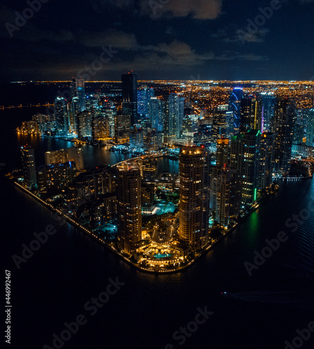downtown miami brickell key city skyline at night from a drone © Aon Prestige Media