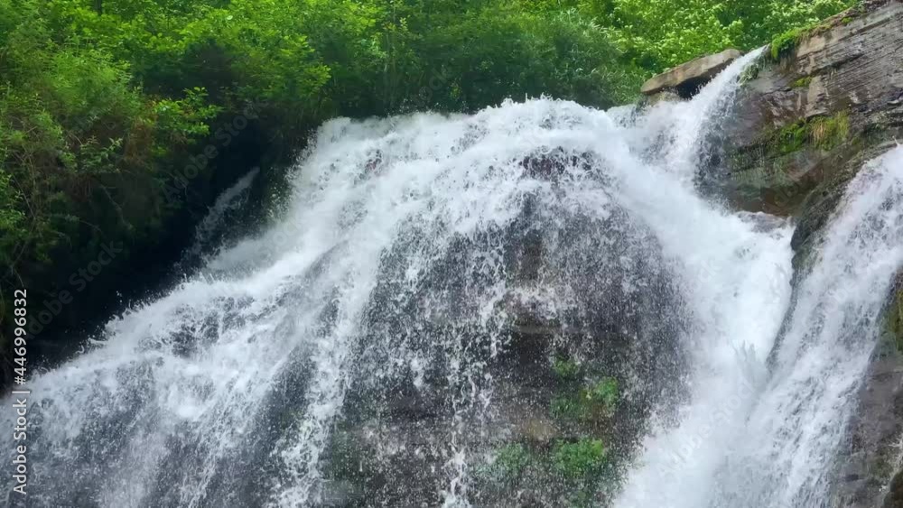 Nice view of the waterfall in the mountains of the North Caucasus. Landscape and nature of the North Caucasus
Nice view of the waterfall in the mountains of the North Caucasus. Landscape and nature of the North Caucasus