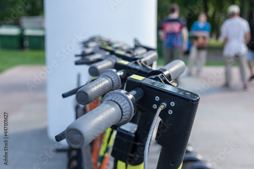 Electric scooter in the station, electric scooters in the parking lot for rent and entertainment of people