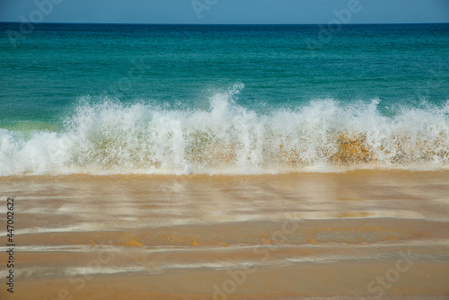 Beautiful tropical landscape sea view with splashed waves. Sea and ocean energy. Relaxation and nature. Space for text
