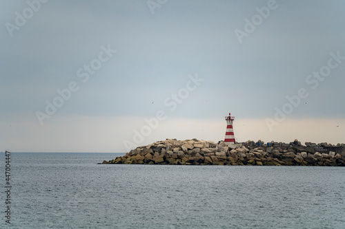 Lighthouse on the beach of Loredo in the municipality of Somo in the province of Santander, with views of the sea and the horizon © MARIO MONTERO ARROYO