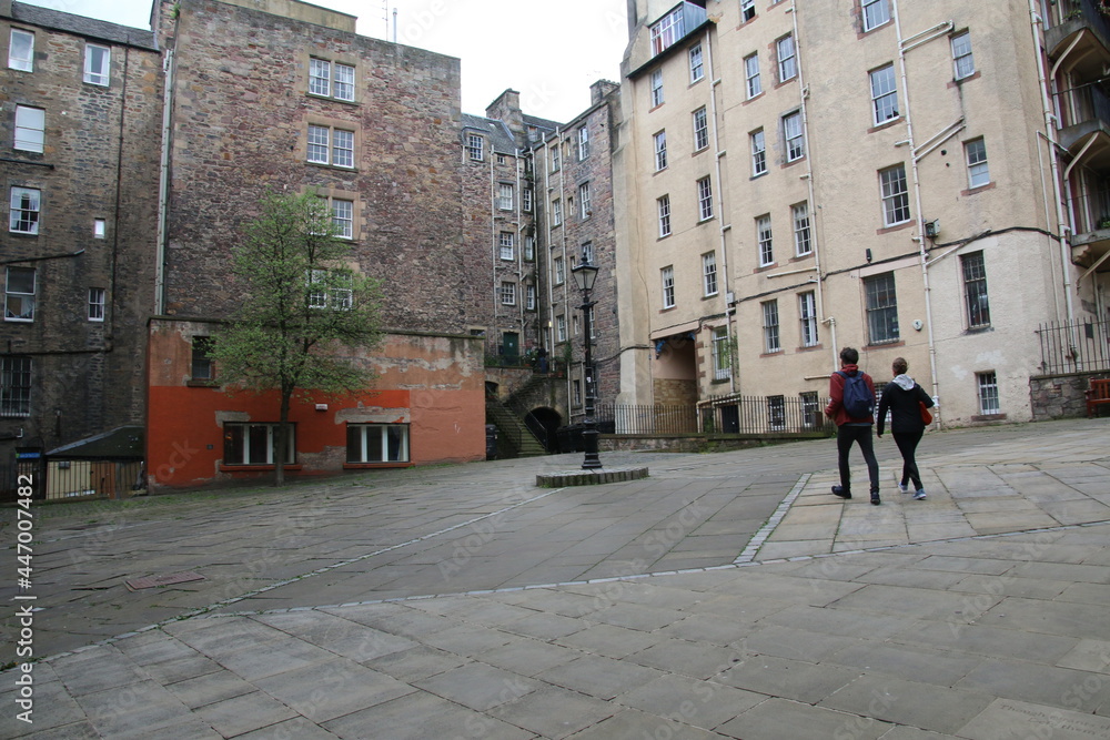 Walking across the square in Edinburgh, Scotland. The writer's museum is to the left of the couple in the image.