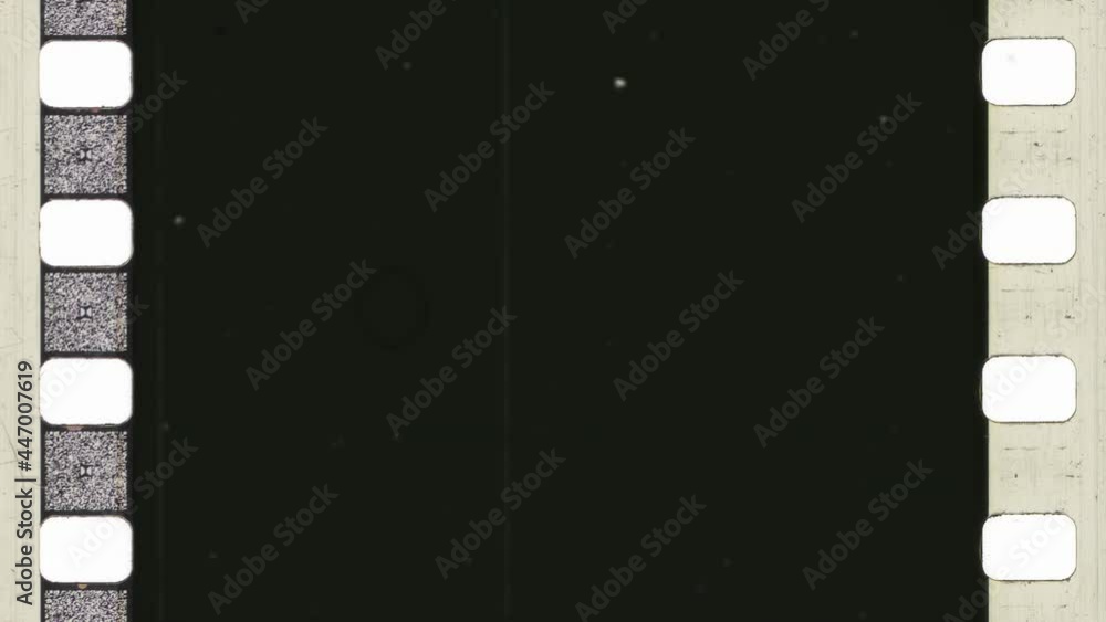 A vintage 35mm film frame with scratches, sprockets and dirt on a