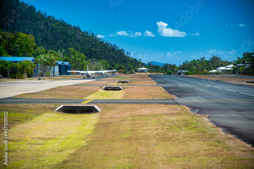 Airlie Beach airport with moving small airplane, Australia.