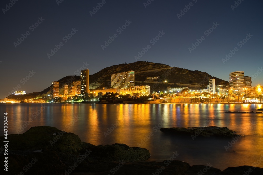 Night view of Alicante, Albufereta beach. Spain.
