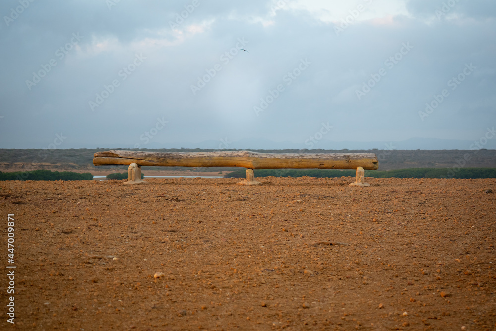 Rustic Wooden Log as a Chair with Ocean View at Punta Gallinas in Uribia, La Guajira, Colombia