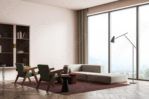 Modern living room interior with wooden floor and big window. Mock up empty wall. Concept of contemporary design.